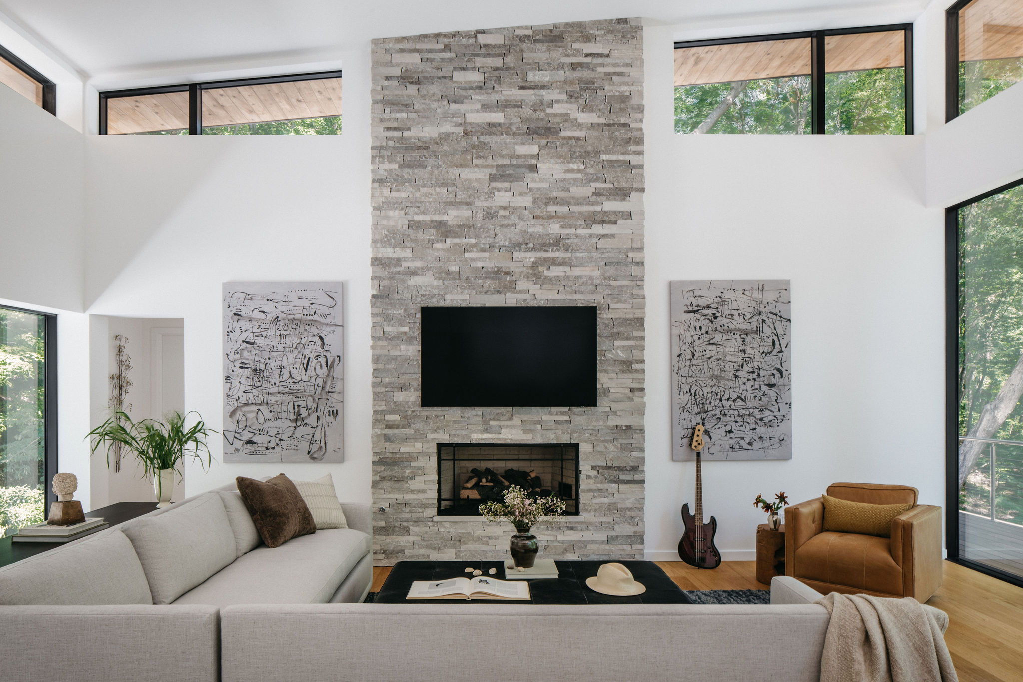 angled-ceiling-living-room-stone-fireplace