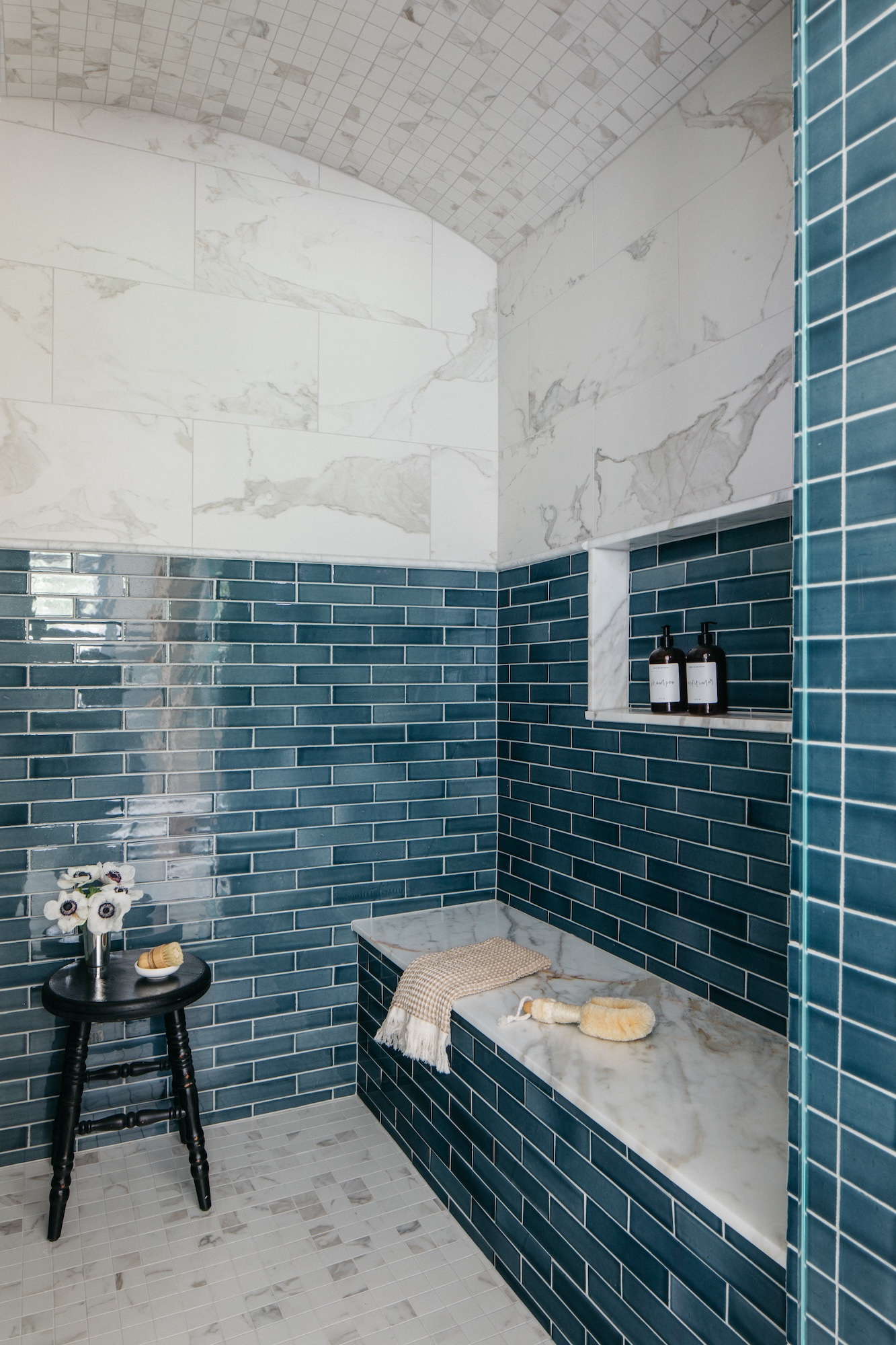 blue-tile-in-shower-with-marble-bench