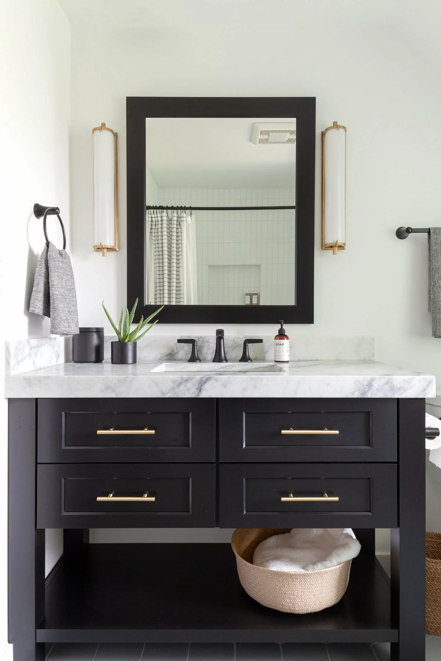 black vanity in bathroom remodel.jpg