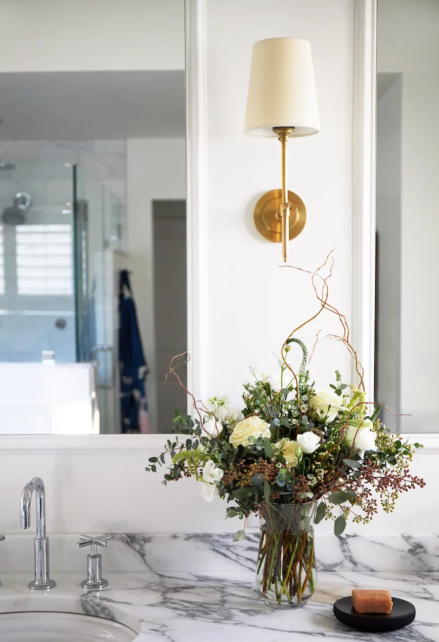 vase-flowers-bathroom-vanity-wall-sconce